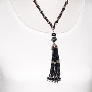 Gold chain necklace with black faux leather.